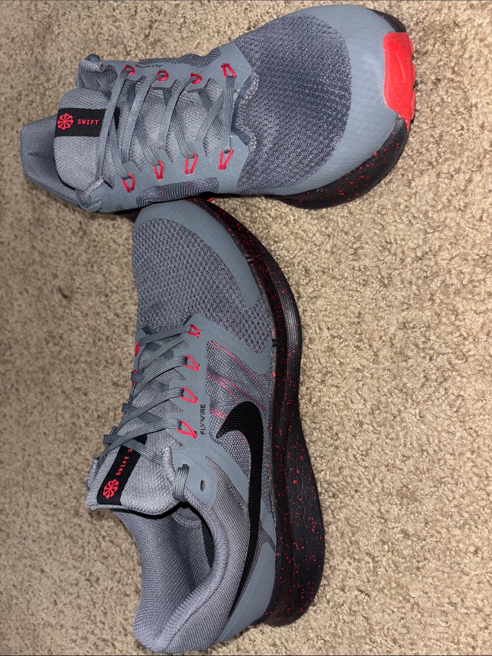 Nike Gray and Black Running Shoes with Red Accents